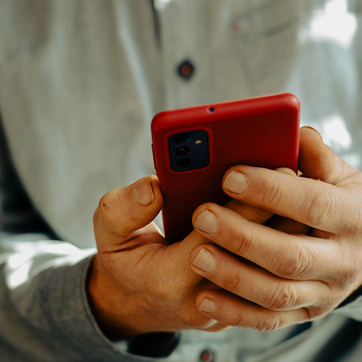 Hands holding a mobile phone